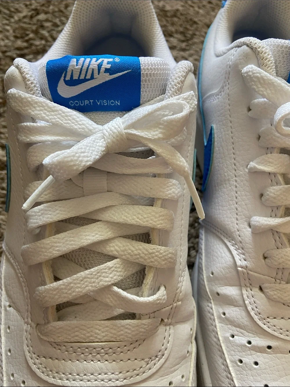 Nike White Low-Top Sneakers with Blue Swoosh